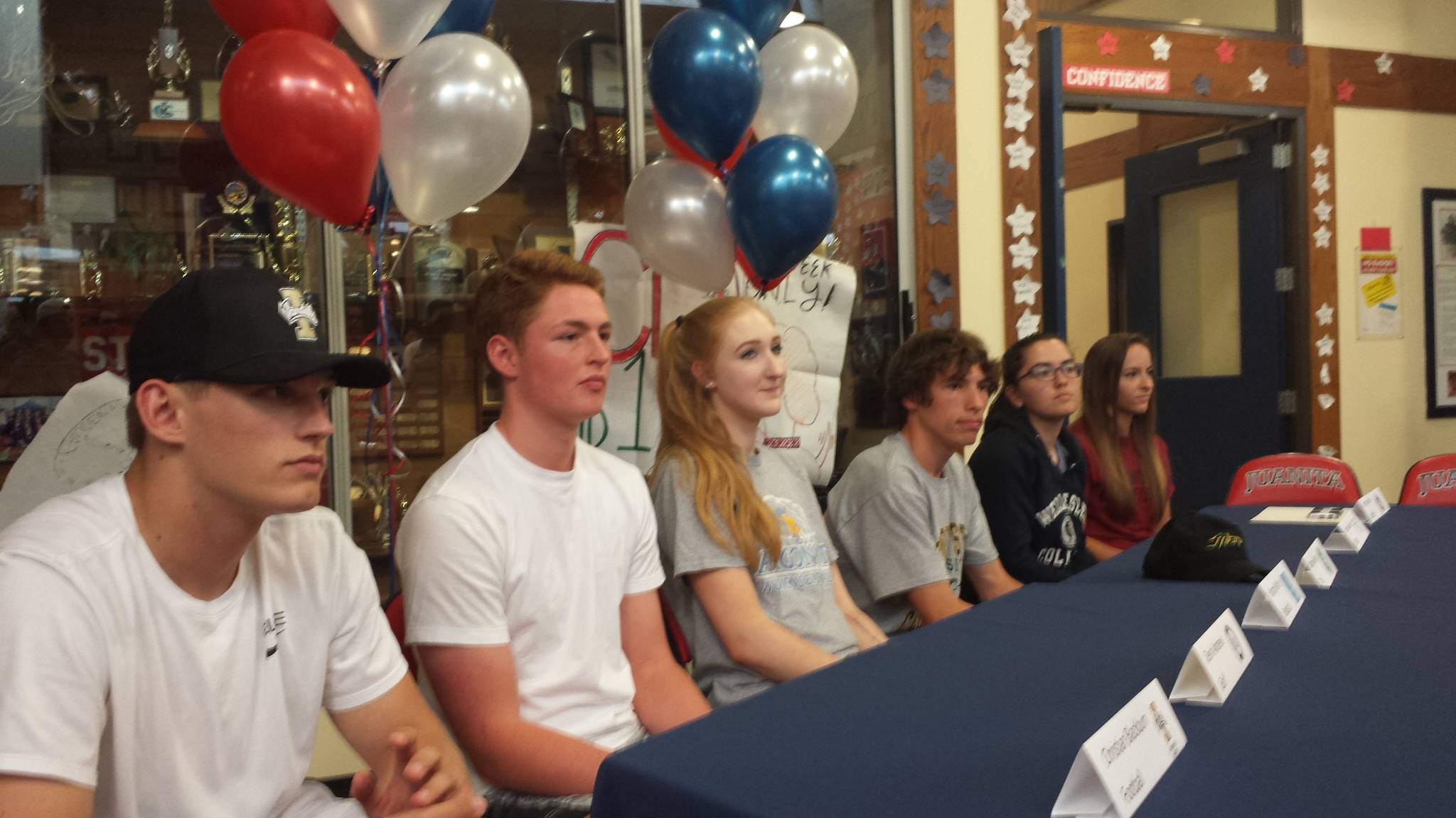 Pictured from left to right, Juanita High athletes who will play in college: Christian Blackburn, Devin Andrews, Brittany White, Michael Gengo, Tatum Kawabata and Brynn Radke. Not pictured, Ravi Regan Hughes. Courtesy of Kim Blackburn