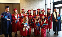 Juanita High School seniors participate in the first-ever “grad walk” at John Muir Elementary School, where they went for their elementary education. Photo courtesy of Lake Washington School District