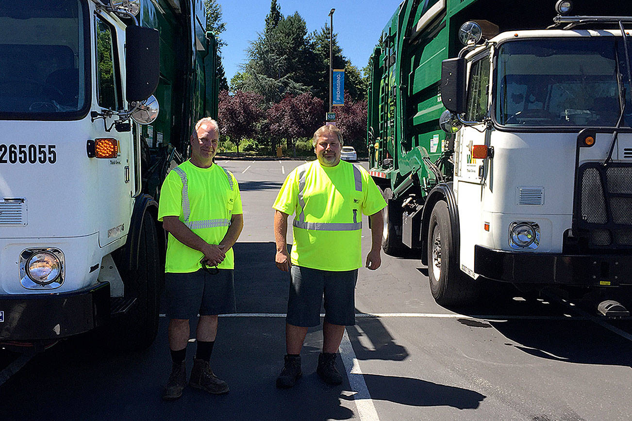 Local garbage truck drivers Steve Wegener (left) and Richard Salts (right) have developed close friendships with their customers in the community. Kailan Manandic, Kirkland Reporter