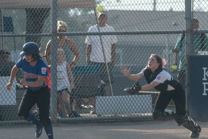 Kirkland catcher Anna Fridell chases down a popup during a Junior League Softball World Series game. Courtesy of Eric Chen