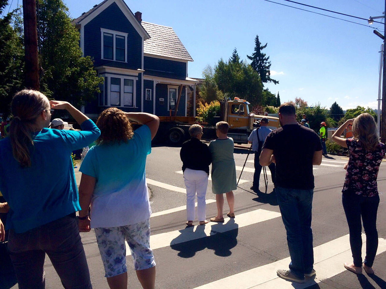 Neighbors watch the house be moved to a temporary location in August 2016. Photo courtesy of the city of Kirkland