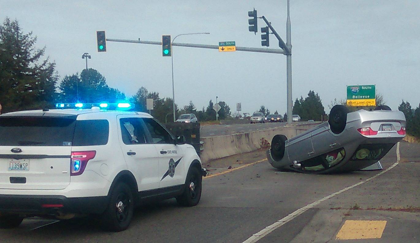 A driver’s vehicle sits upside down on the Interstate 405 north onramp this morning. Andy Nystrom, Kirkland Reporter