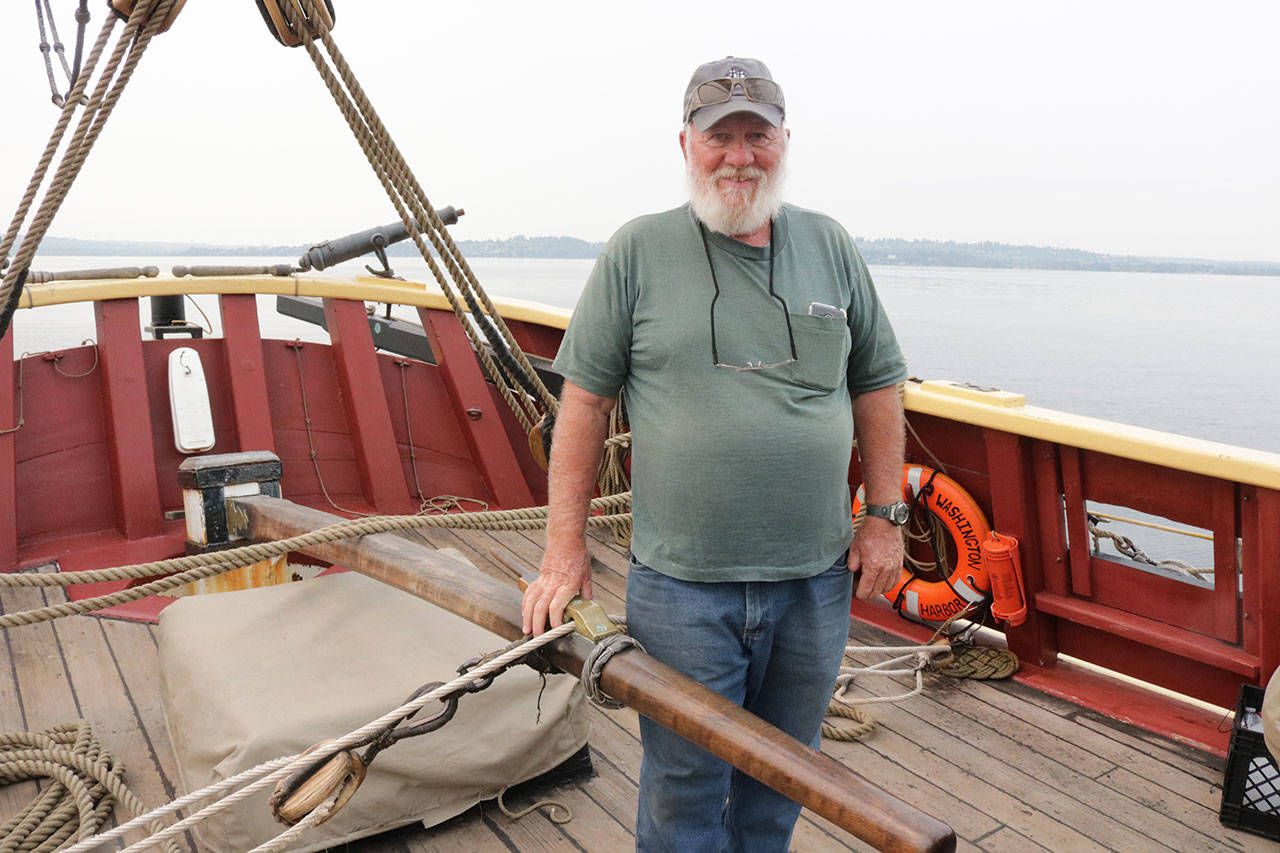 Bob Nelson, captain of the Lady Washington, stands at the tiller, which is made of purple heart wood and connected directly to the rutter. Megan Campbell/Kirkland Reporter