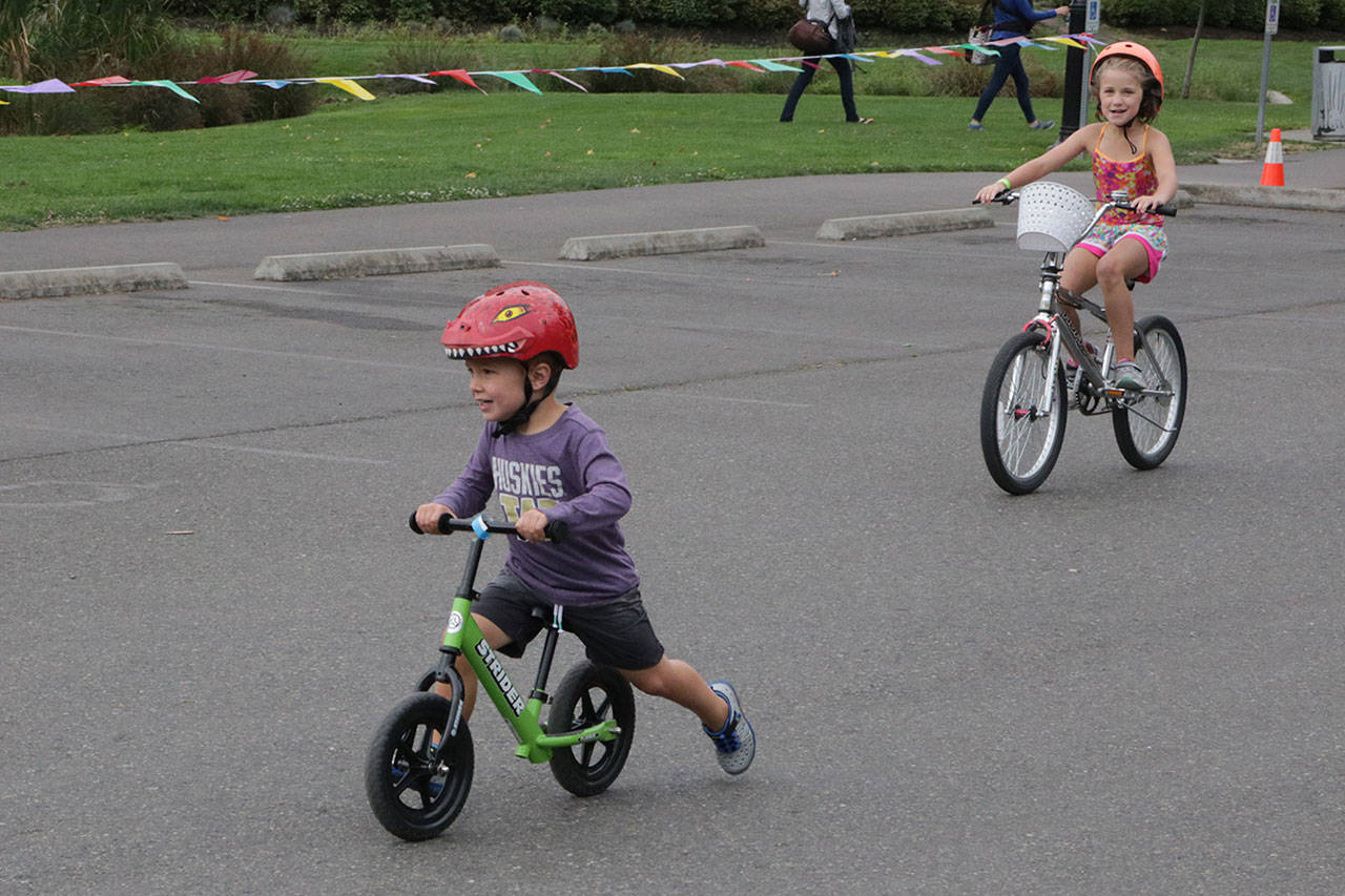 Paxton Francois, 3, rides his bike during the second part of the triathlon Saturday. Megan Campbell/Kirkland Reporter