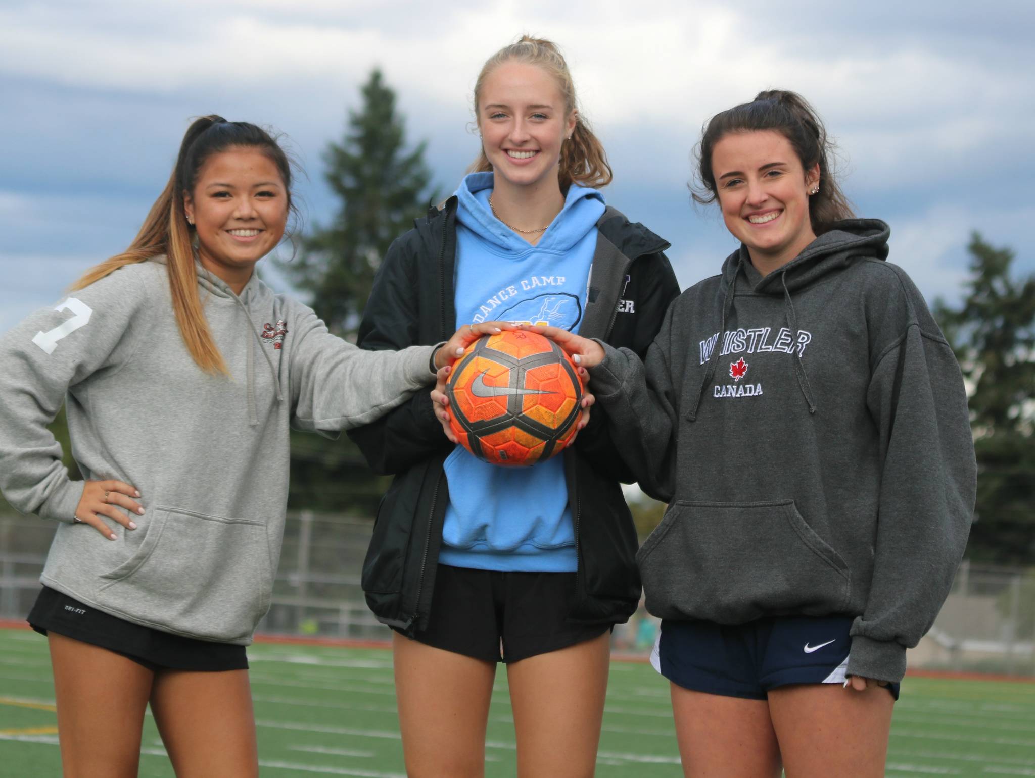 Lake Washington High players, from left, Carlee Betterman, Gracie Sturdevant and Megan McCarthy. Andy Nystrom, Kirkland Reporter
