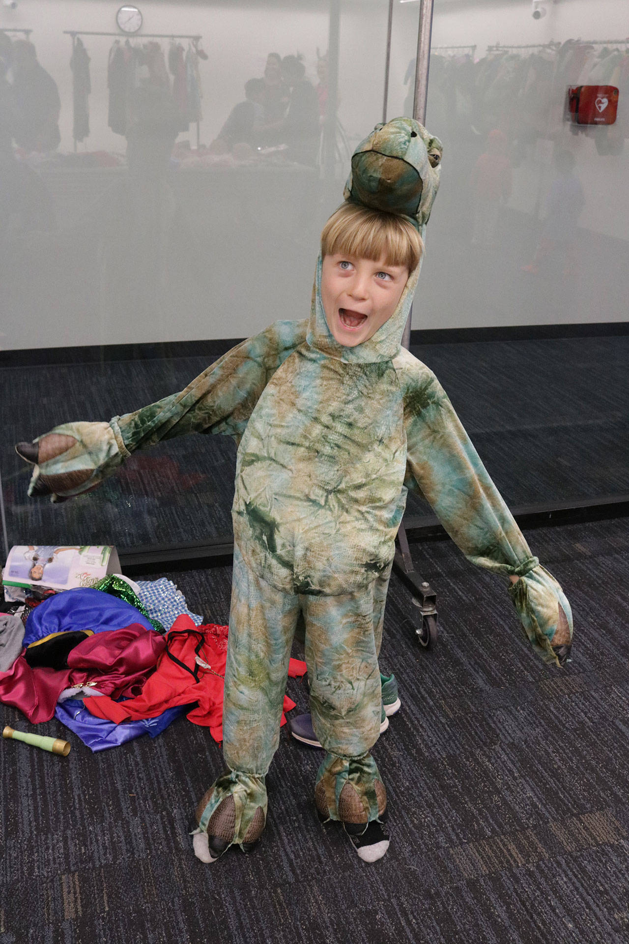Ciaran Lewbel, 8, rawrs like a dinosaur during the costume swap Saturday. Megan Campbell/Kirkland Reporter