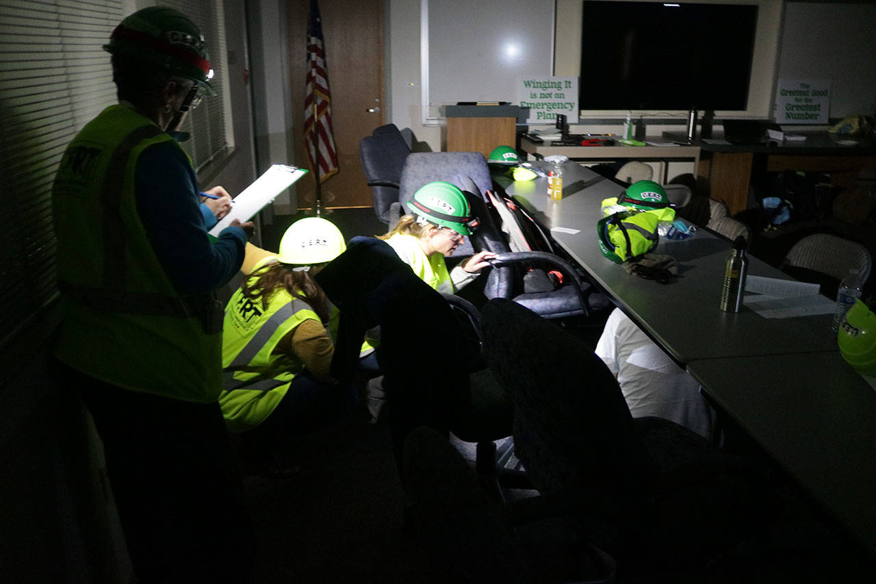 CERT trainees conduct light search and rescue operations during a training exercise. Megan Campbell/Kirkland Reporter