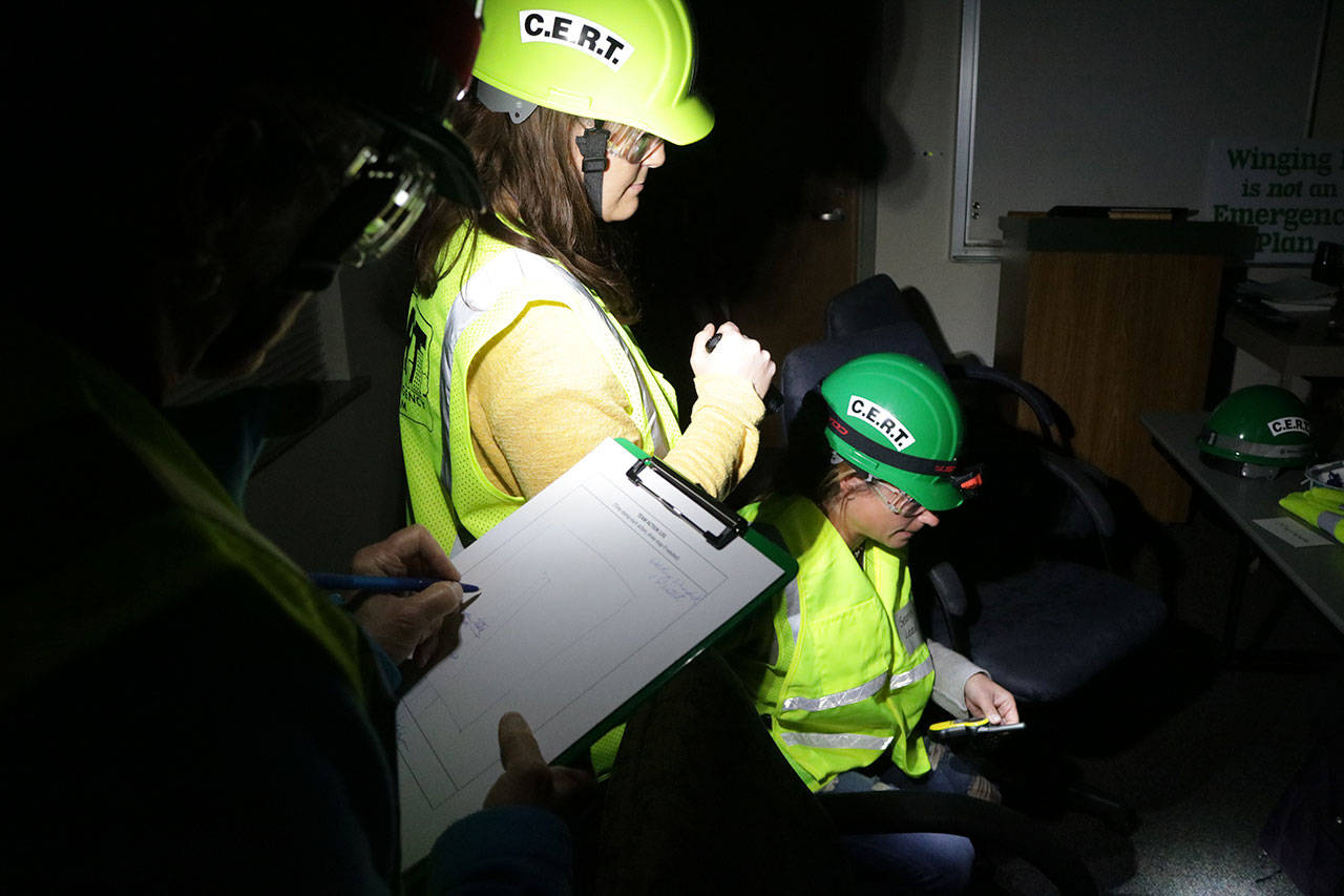 CERT trainees conduct light search and rescue operations during a training exercise. Megan Campbell/Kirkland Reporter