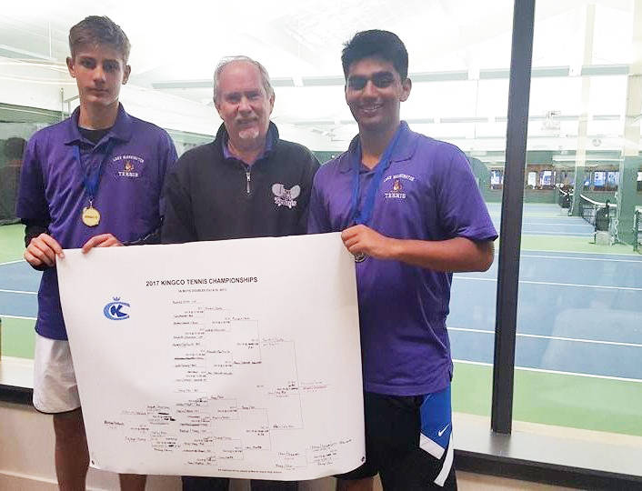 Lake Washington High’s doubles tennis team of freshman Nedim Suko, left, and junior Shubhu Purohit won the 3A KingCo title on Oct. 10 at Mercer Island Country Club. They defeated Mercer Island’s Kevin Chen and Jack Mattox, 6-2, 6-2, in the final. The Kangs are pictured with coach John Stalker. Courtesy of Bhanu Purohit