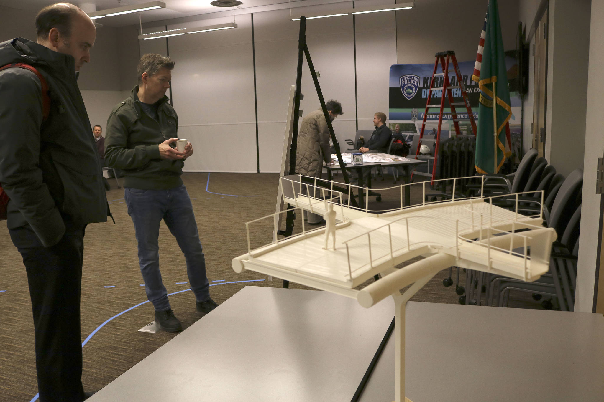 Community members review the current designs of the Totem Lake Connector Bridge and the proposed “plank” overlook that will offer a unique view of Totem Lake. Kailan Manandic, Kirkland Reporter