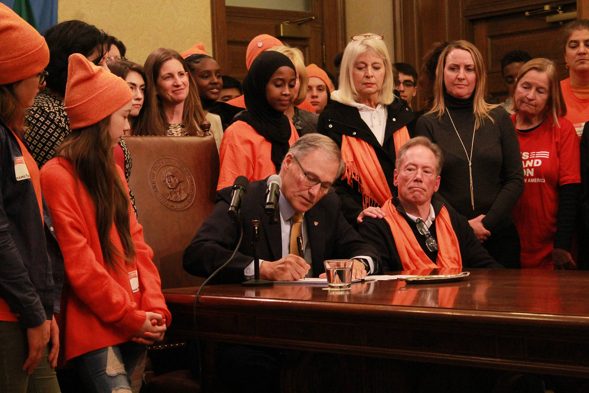 Governor Jay Inslee signs a ban on bump stocks on Tuesday, March. 6. Photo by Taylor McAvoy