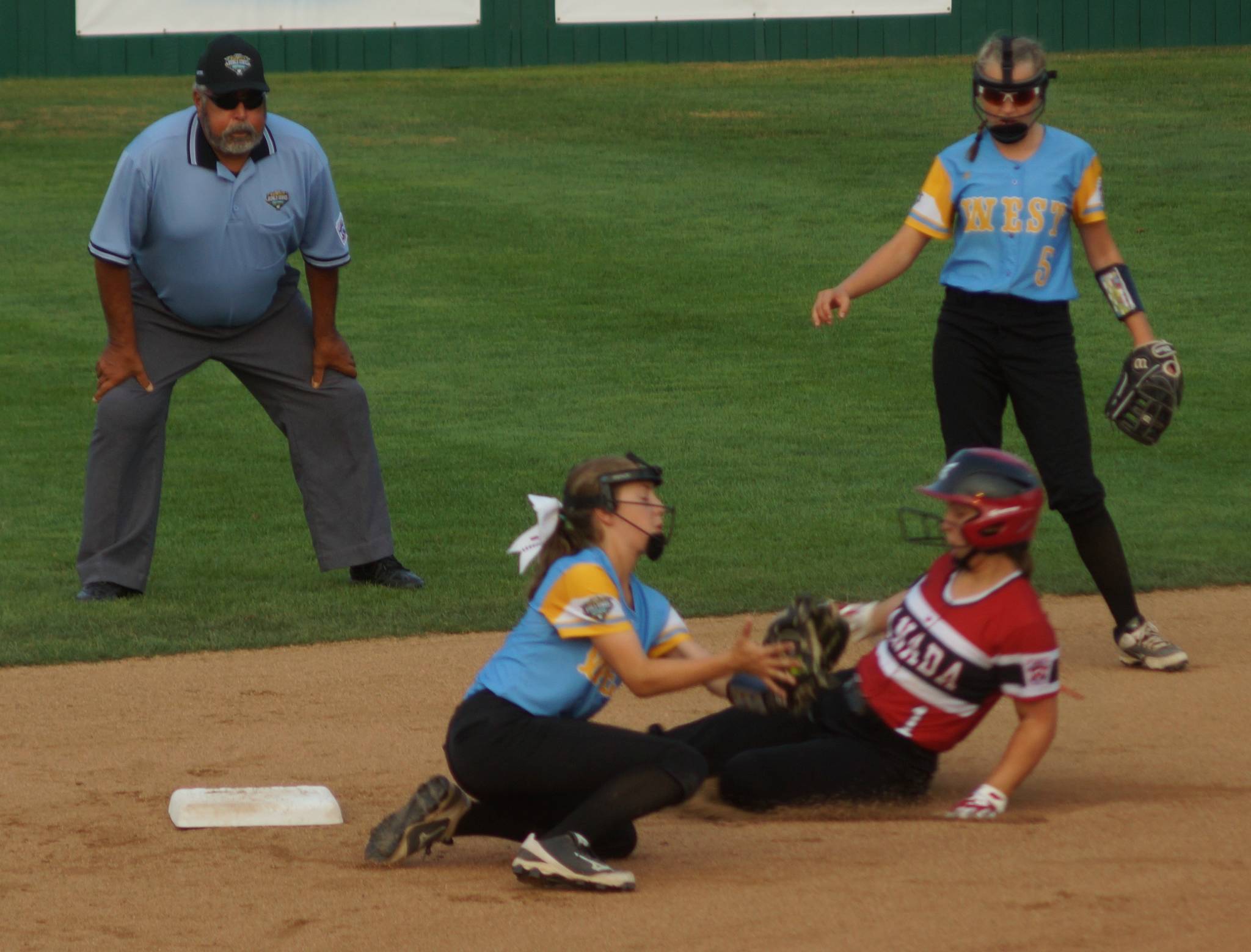Christina Minor makes a play at second as Bella Ely stands by. Courtesy of workmac-LLSWS