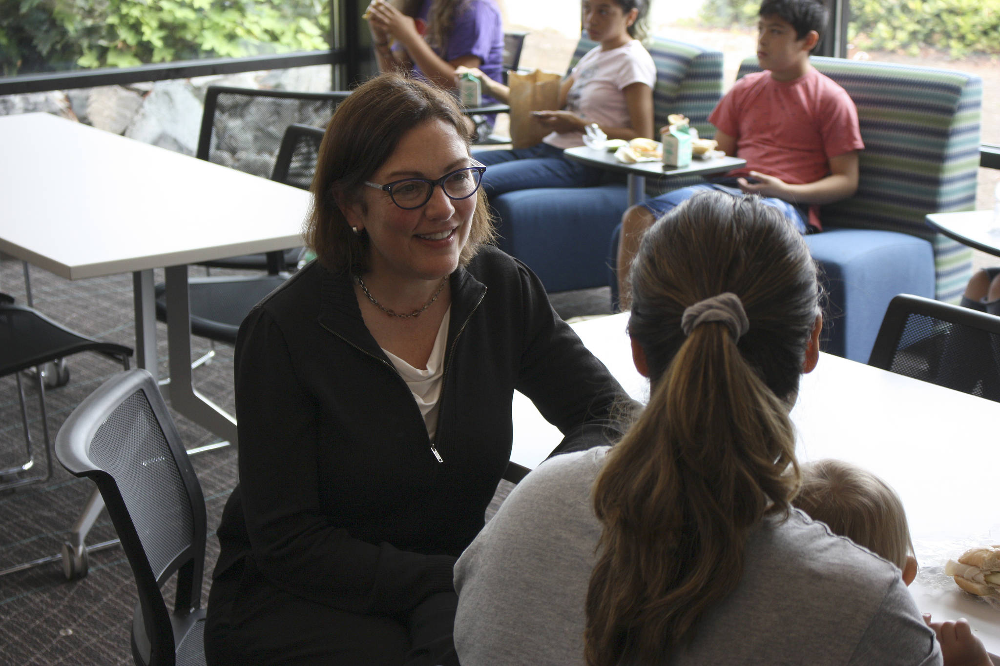 Rep. Suzan DelBene talks with local parents about what they think of the Summer Meals program that aims to help hungry children. Kailan Manandic/staff Photo