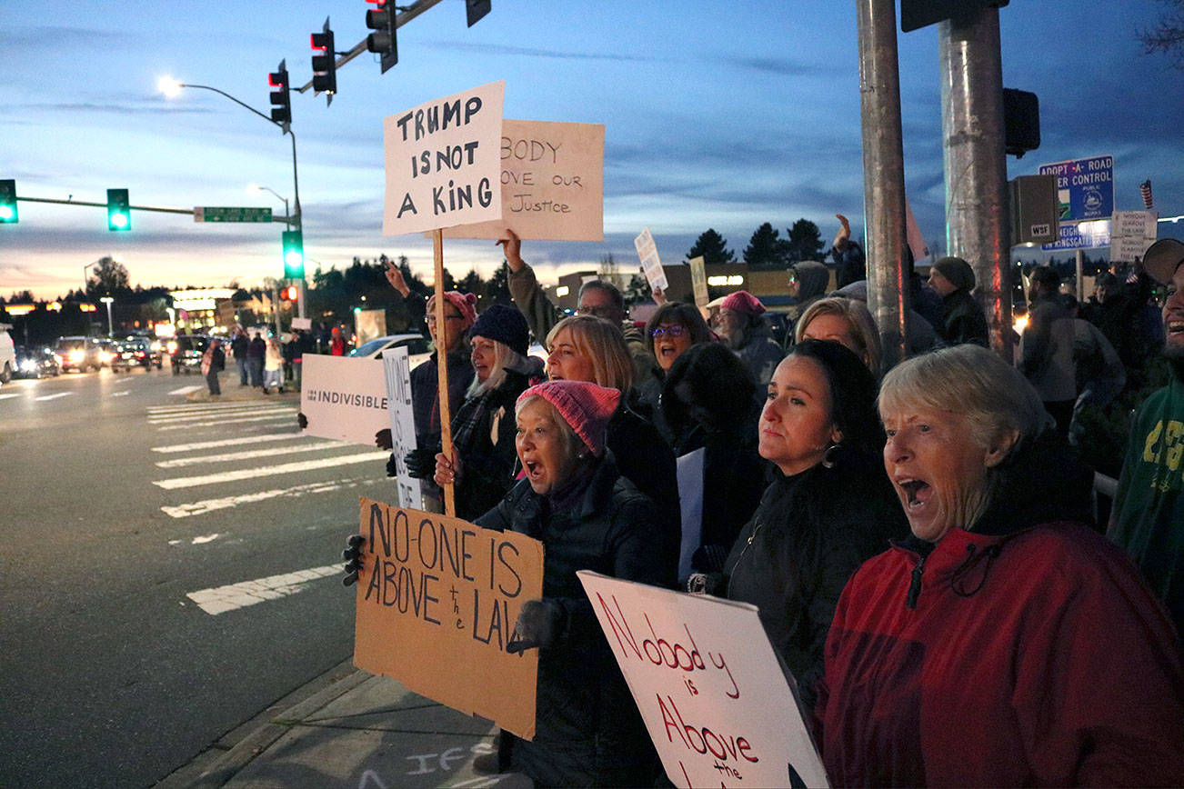 Protesters chant “What do we want? Justice! When do we want it? Now!” at the intersection of Northeast 124th Street and 124th Avenue Northeast Thursday evening. Kailan Manandic, staff photo