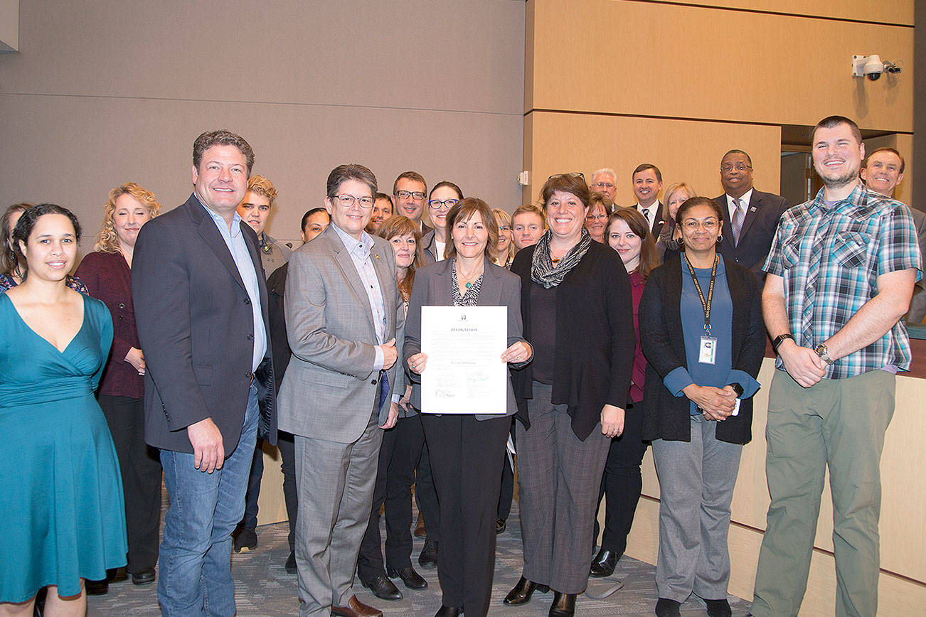 The Council recognized the AFIS program as it celebrates 30 years of assisting law enforcement throughout King County. Councilmembers, AFIS staff and King County Sheriff Mitzi Johanknecht join AFIS regional manager, Carol Gillespie. Photo courtesy of King County.