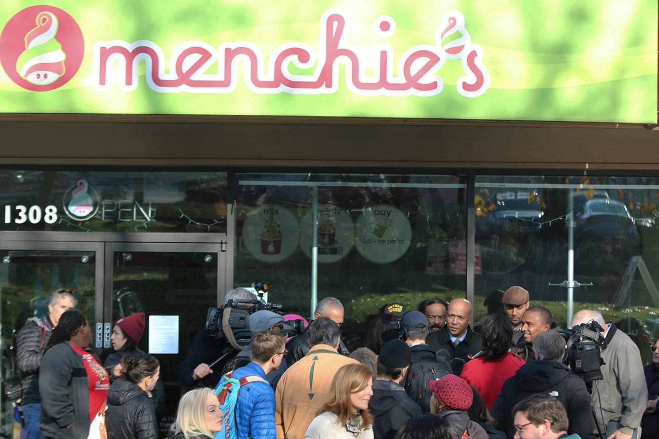 People protest at Totem Lake Menchie’s regarding black man being asked to leave store