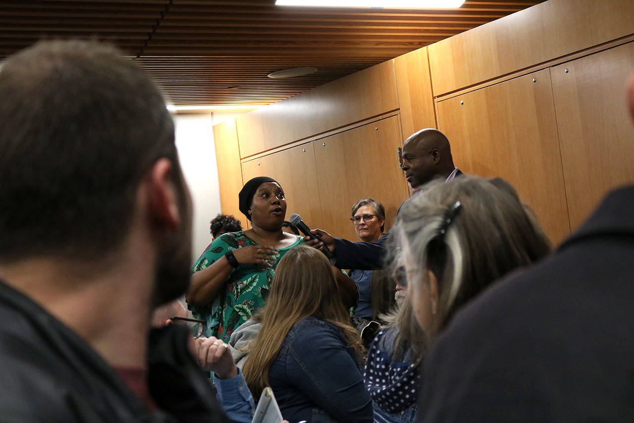 Community members state what they want to see changed as Kirkland moves forward from the Menchie’s incident. Other attendees would then hold up a number of fingers to indicate how much they agreed with the statement. Kailan Manandic, staff photo