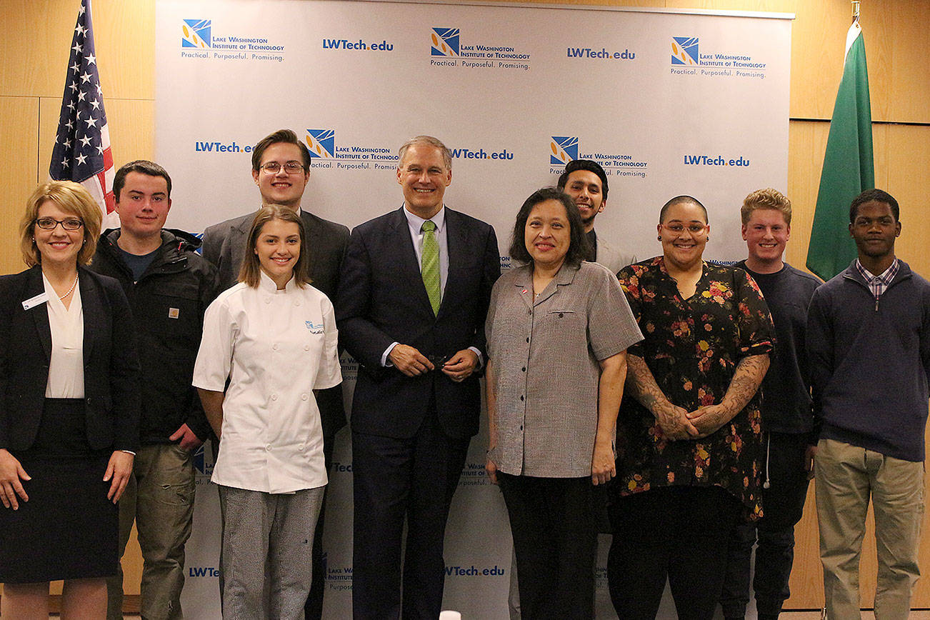 Washington Gov. Jay Inslee visited students and faculty at the Lake Washington Institute of Technology in Kirkland Tuesday afternoon. From left: Dr. Amy Morrison Goings, Gage Wollman, Natalie Alvis, Ellienn Shouse, Gov. Jay Inlsee, Virginia King, Pablo Bautista, Sloane Hunt, Cole Galino, and Tevin Wright. Madison Miller/staff photo.