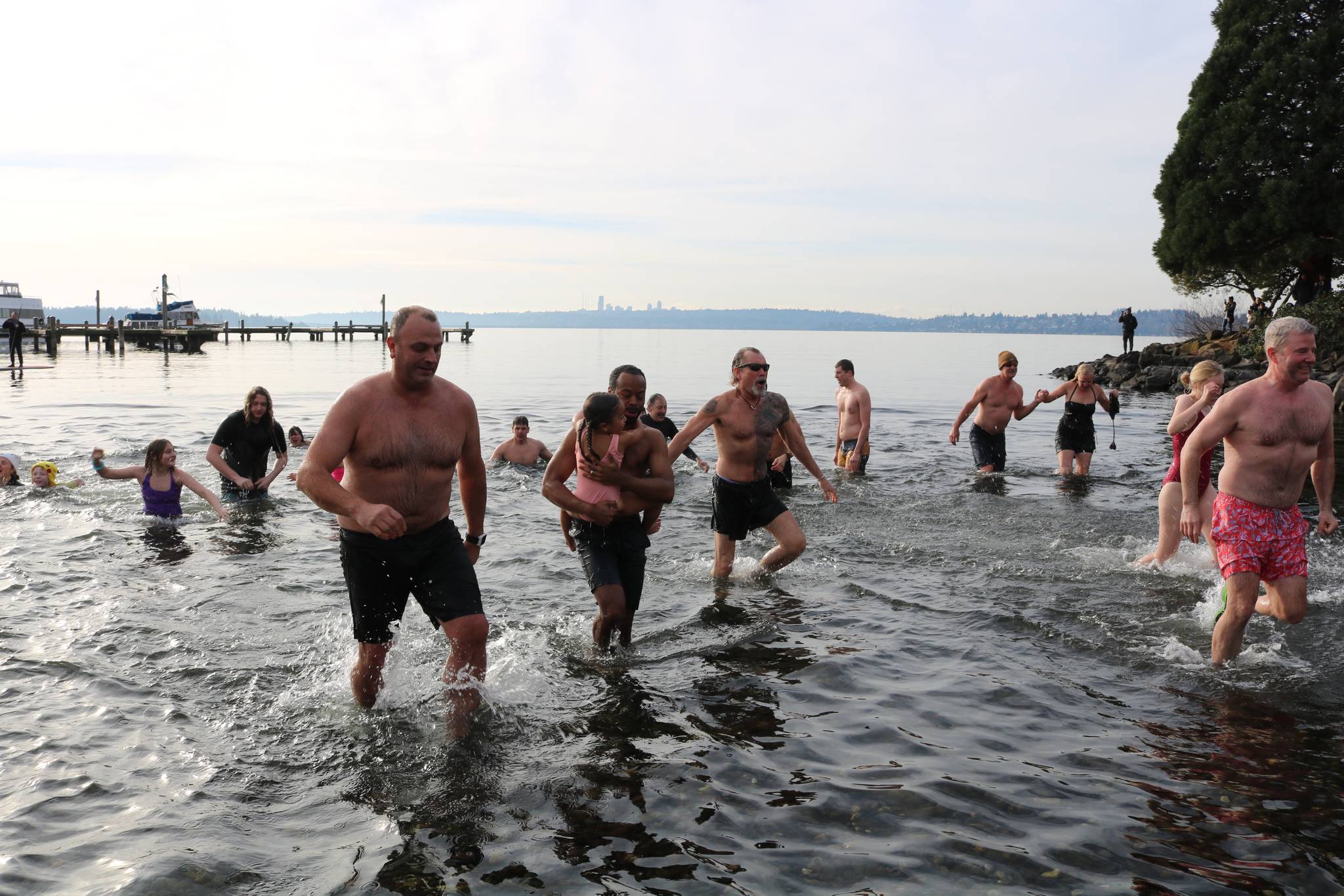 More than 100 plunge into chilly Lake Washington in Kirkland to ring in the  New Year, Photos