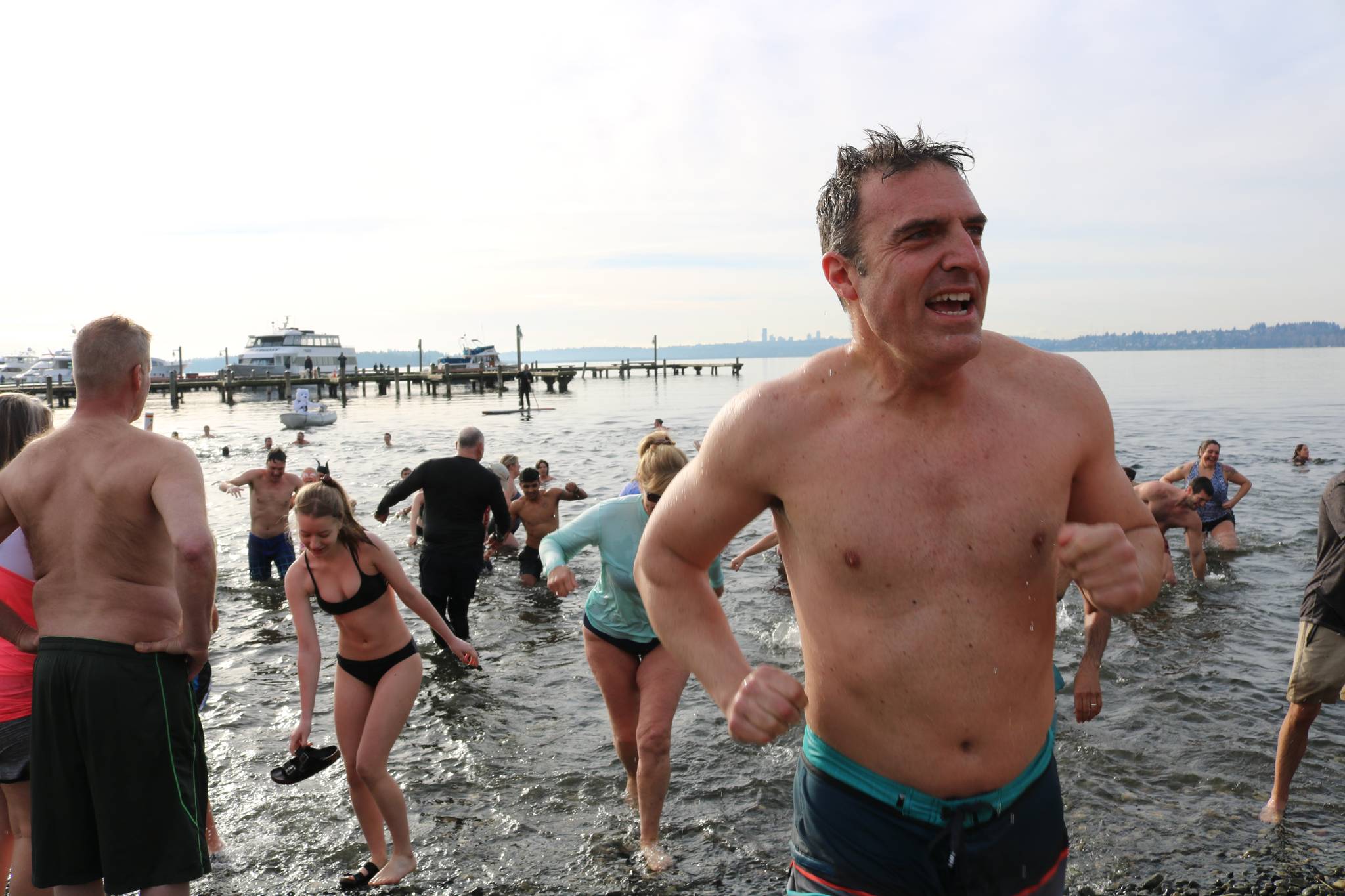 More than 100 plunge into chilly Lake Washington in Kirkland to ring in the  New Year, Photos