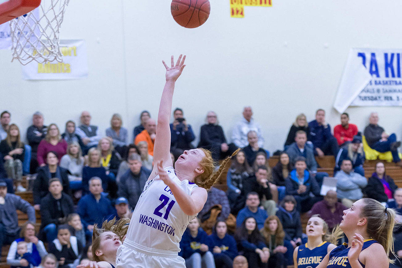 Lake Washington junior guard Jen Estes (pictured) drives to the hoop for a basket against the Bellevue Wolverines in the 3A KingCo tournament championship game on Feb. 6 at Newport High School in Factoria. The Kangaroos defeated the Wolverines 53-43. Photo courtesy of Patrick Krohn/Patrick Krohn Photography