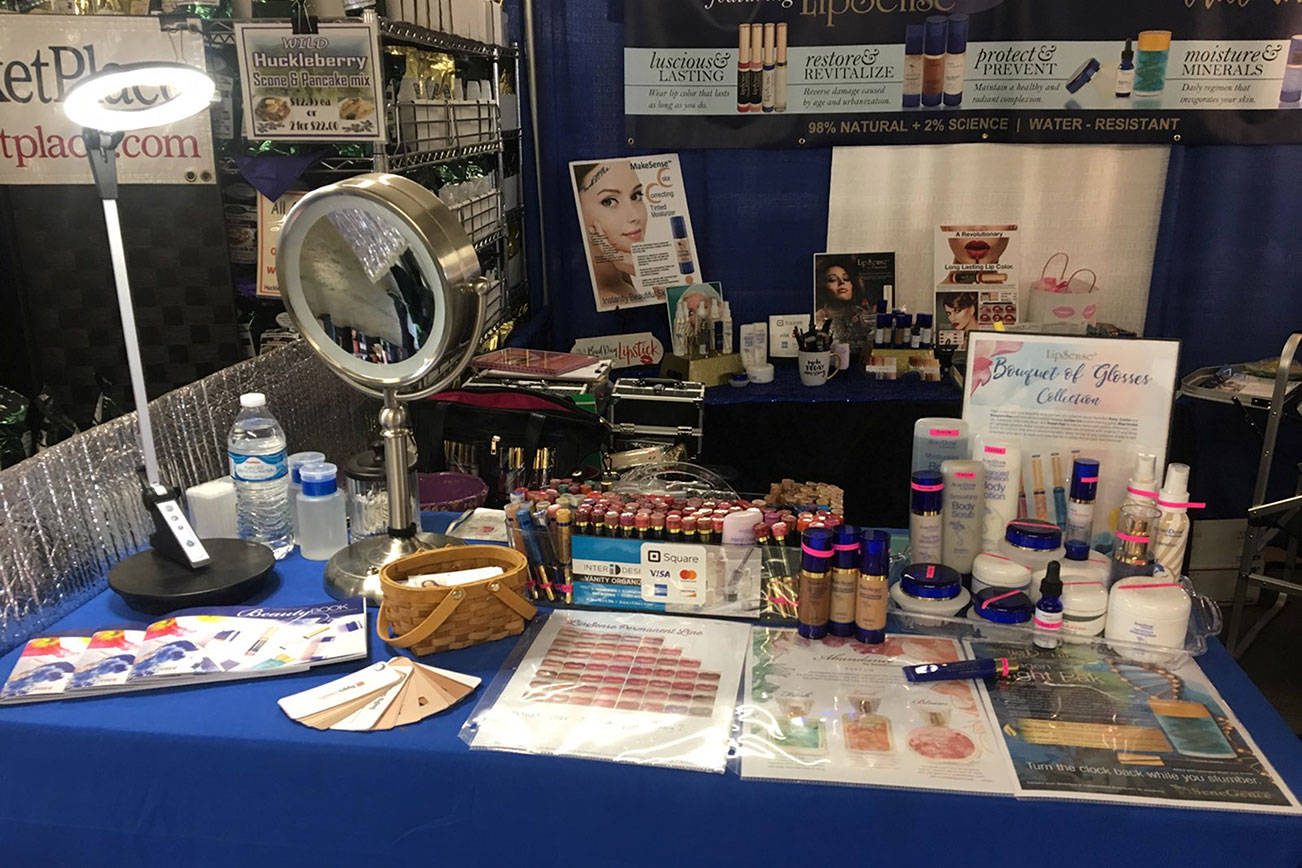 Kristina Perdue sets up her vendor booth for cosmetic distributor SeneGence International. Before starting the Kirkland Women’s Show, Perdue and other Eastside vendors would have to travel out of the Eastside just to compete with bigger corporate vendors. Photo courtesy of Kristina Perdue