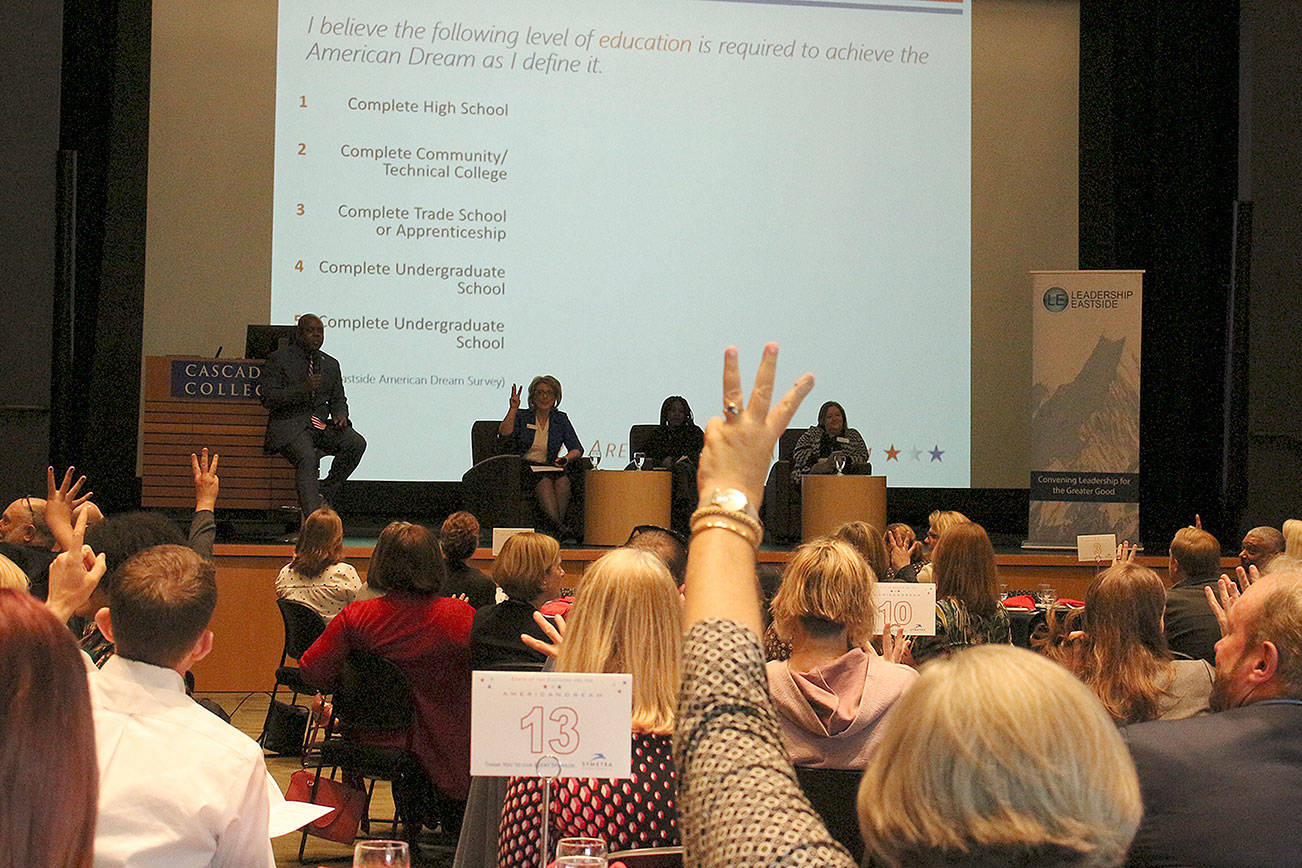 Panel luncheon audience members predict survey results in regard to what Eastsiders consider to make up the American Dream. From left: James Whitfield, Dr. Amy Morrison, Anne Morisseau and Anne-Marie Diouf. Madison Miller / staff photo