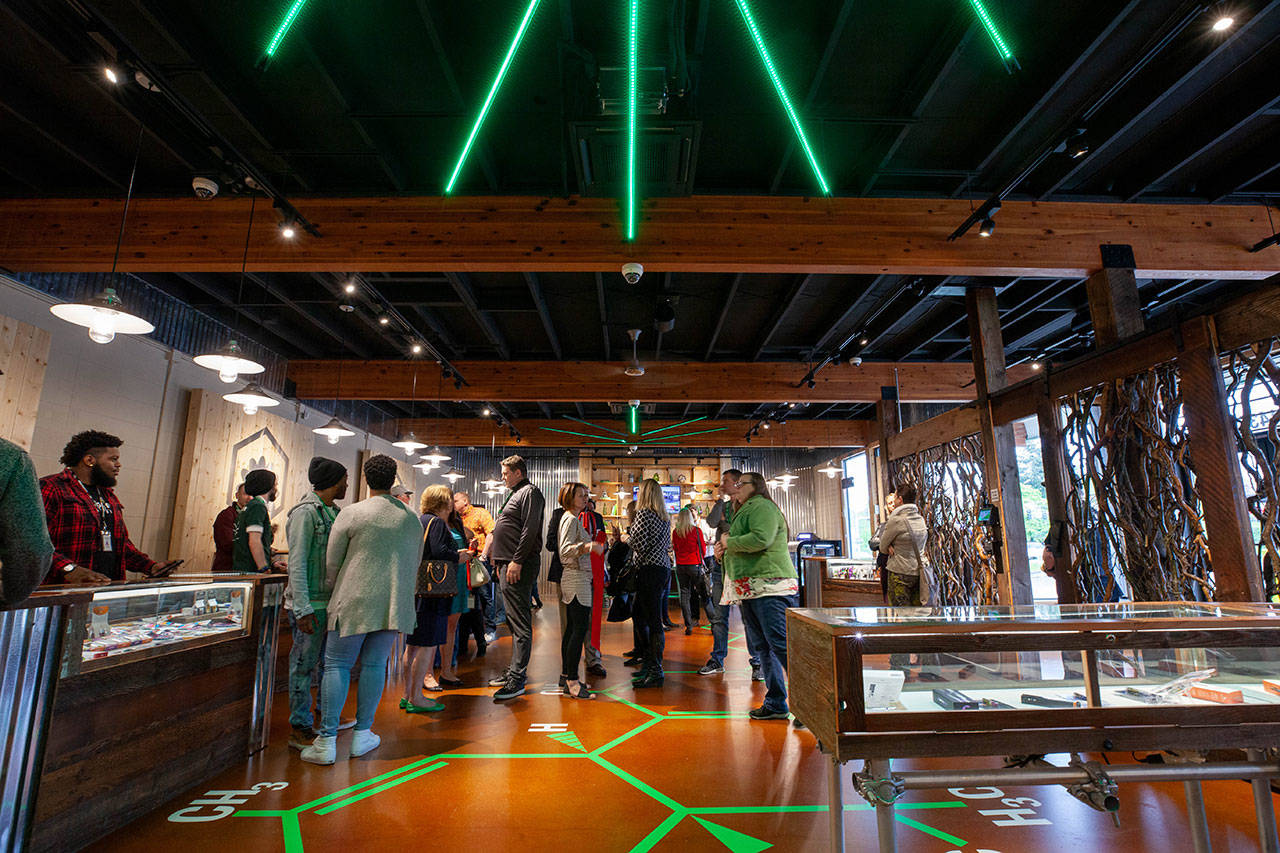 Courtesy photo                                Locals celebrate Kirkland’s newest pot shop, The Evergreen Market, which opened April 25.