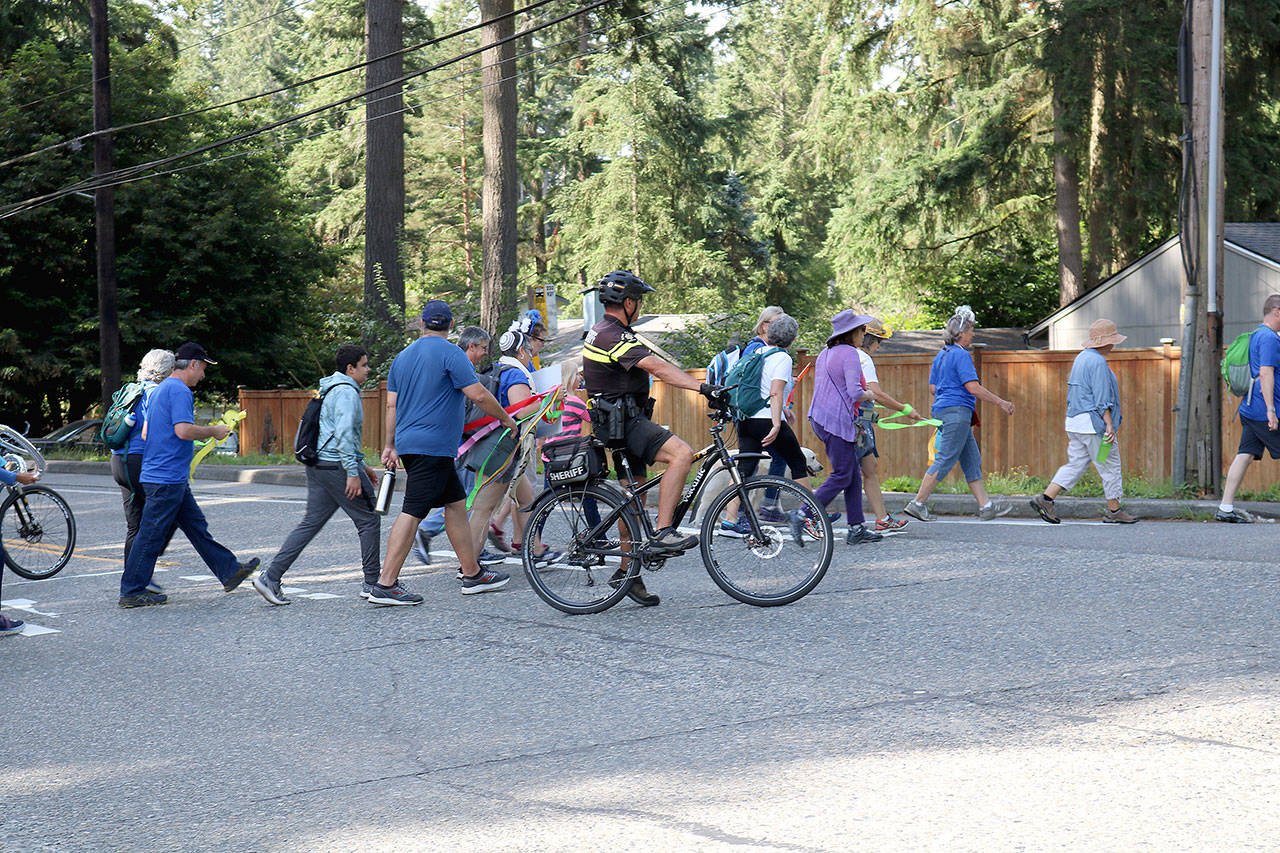 The Kol Ami congregation walked 12 miles from their shared space location in Woodinville to their new shared space in Kirkland. Two officers accompanied the congregation on June 29. Stephanie Quiroz/staff photo