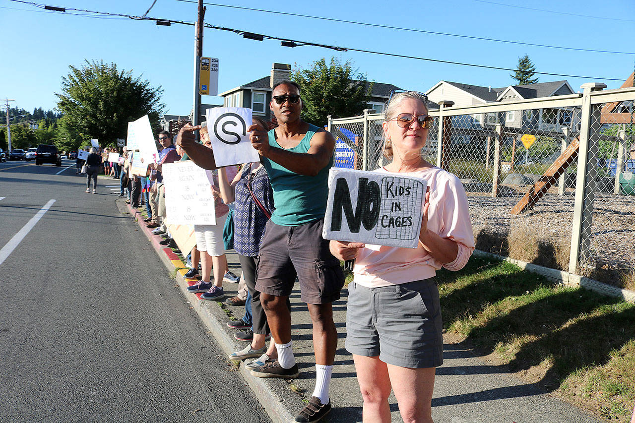 Kol Ami members and Kirkland residents spread out on State St. to protest the conditions of those being held at detention centers near the border. Stephanie Quiroz/staff photo