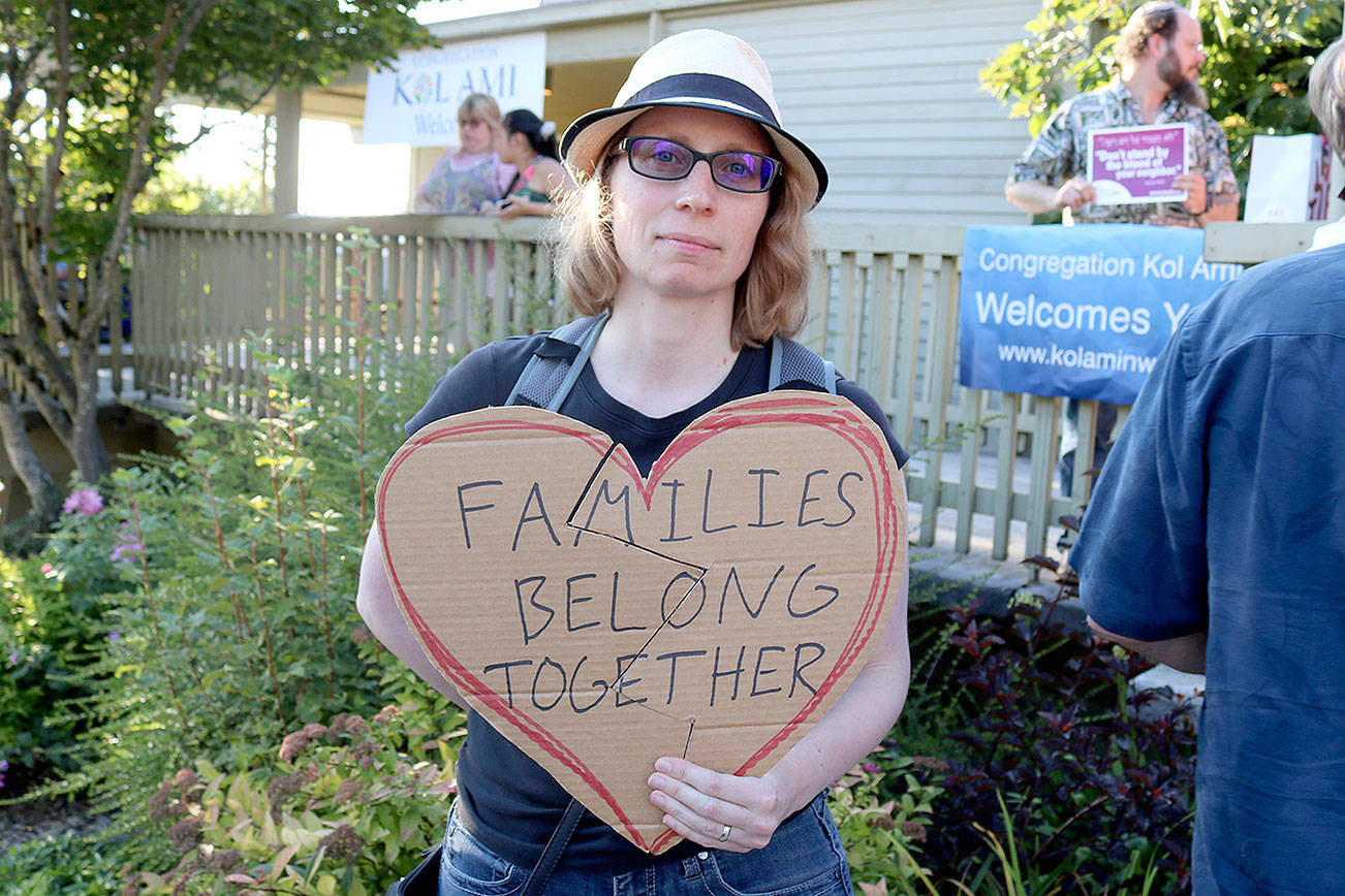 Kirkland resident Elizabeth Standal holds broken heart at the Lights for Liberty Vigil on July 12. Stephanie Quiroz/staff photo