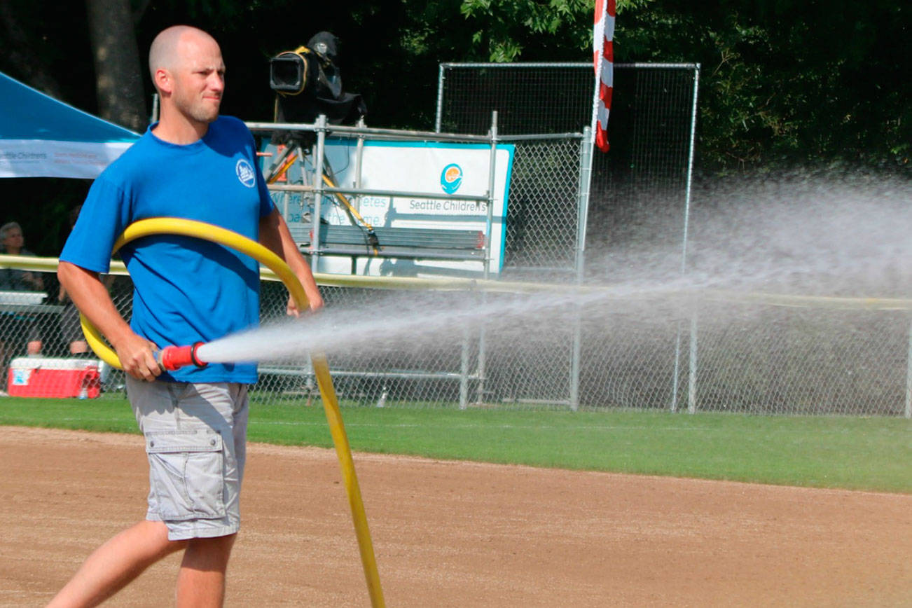 Grooming the diamond at the Junior League Softball World Series