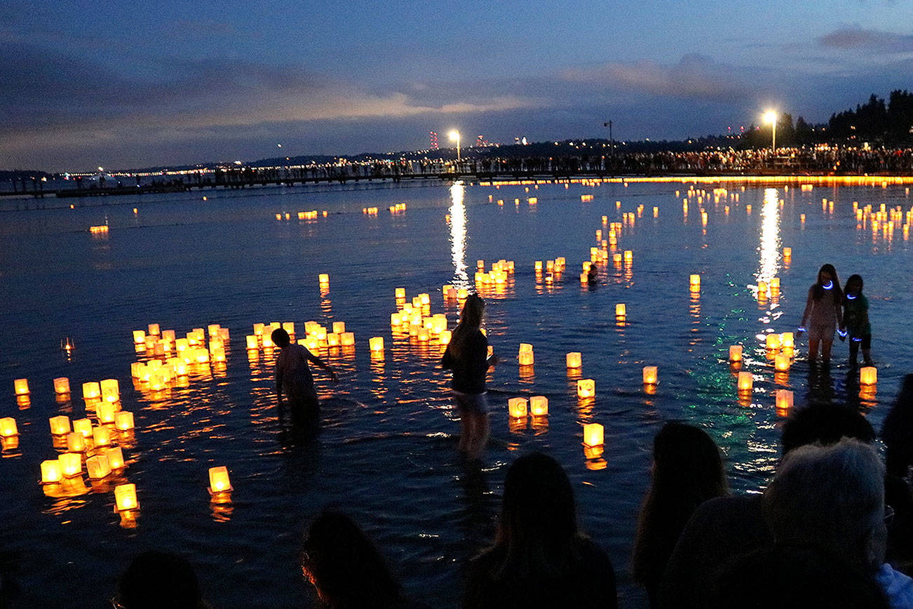 Friends and family gathered at the 1000 Lights Water Lantern Festival at Juanita Beach Park on Aug. 10. Stephanie Quiroz/staff photo