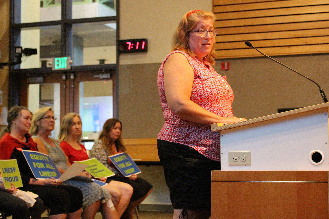 Madison Miller/staff photo                                Melody Kieffer, an office manager at Laura Ingalls Wilder Elementary School, addresses the school board on Monday.