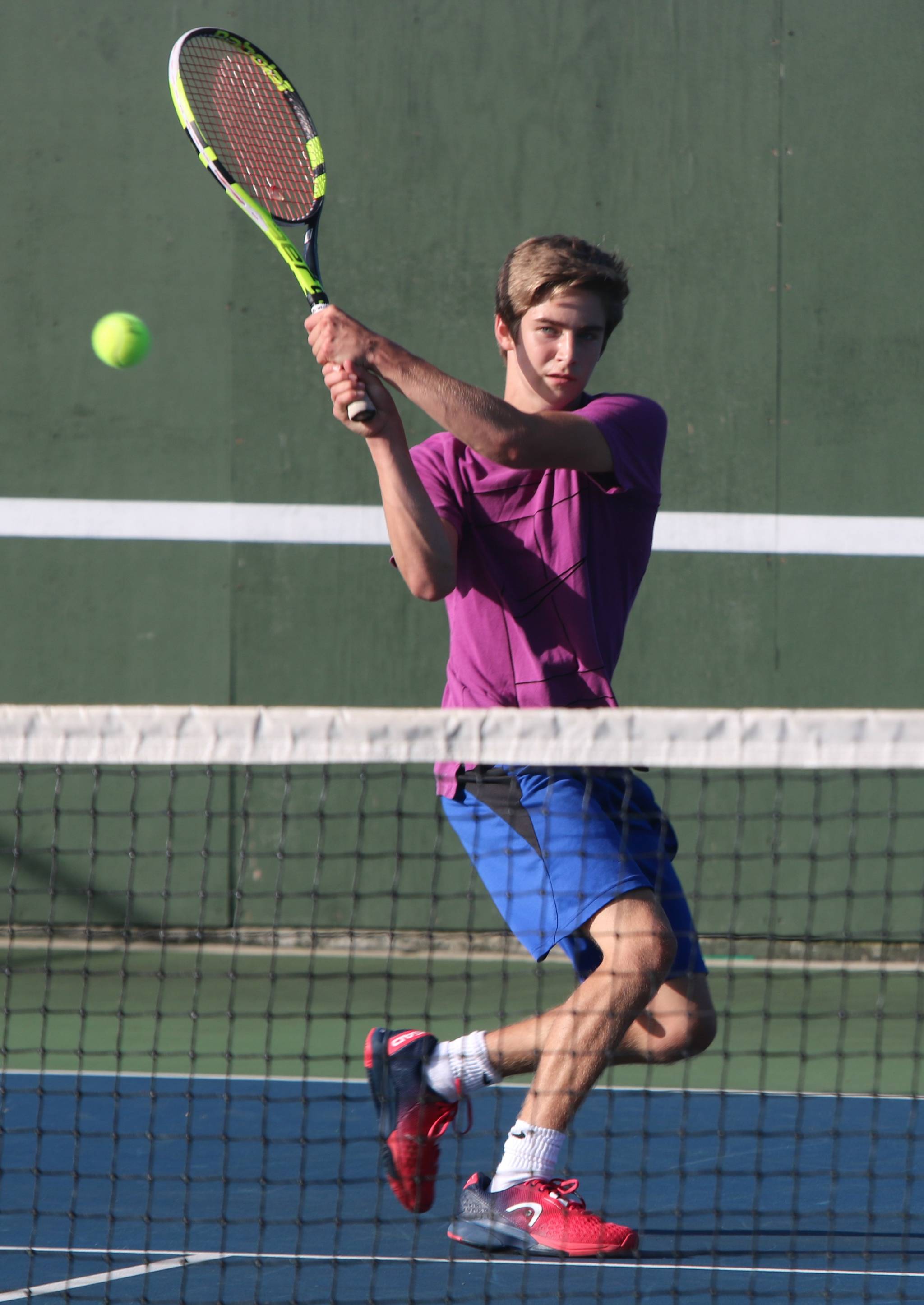 Juanita’s No. 1 singles player Dylan Bard hits a backhand against Lake Washington on Sept. 26. Andy Nystrom/ staff photo