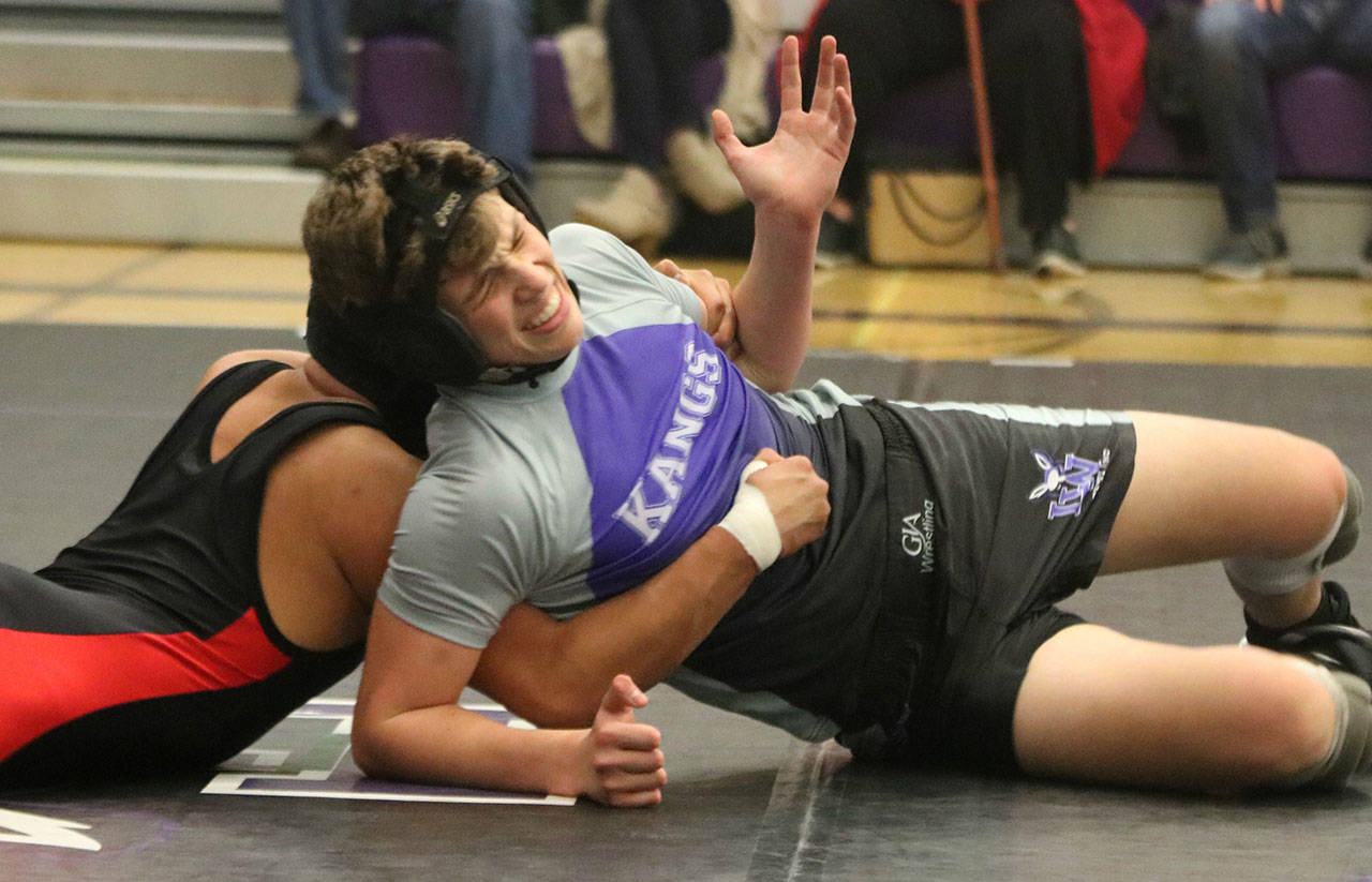 Lake Washington’s Max Reisman works his way out of a hold against his Sammamish foe on Dec. 5 at Lake Washington High. Reisman won, 10-6, in the 138-pound match. Andy Nystrom/ staff photo
