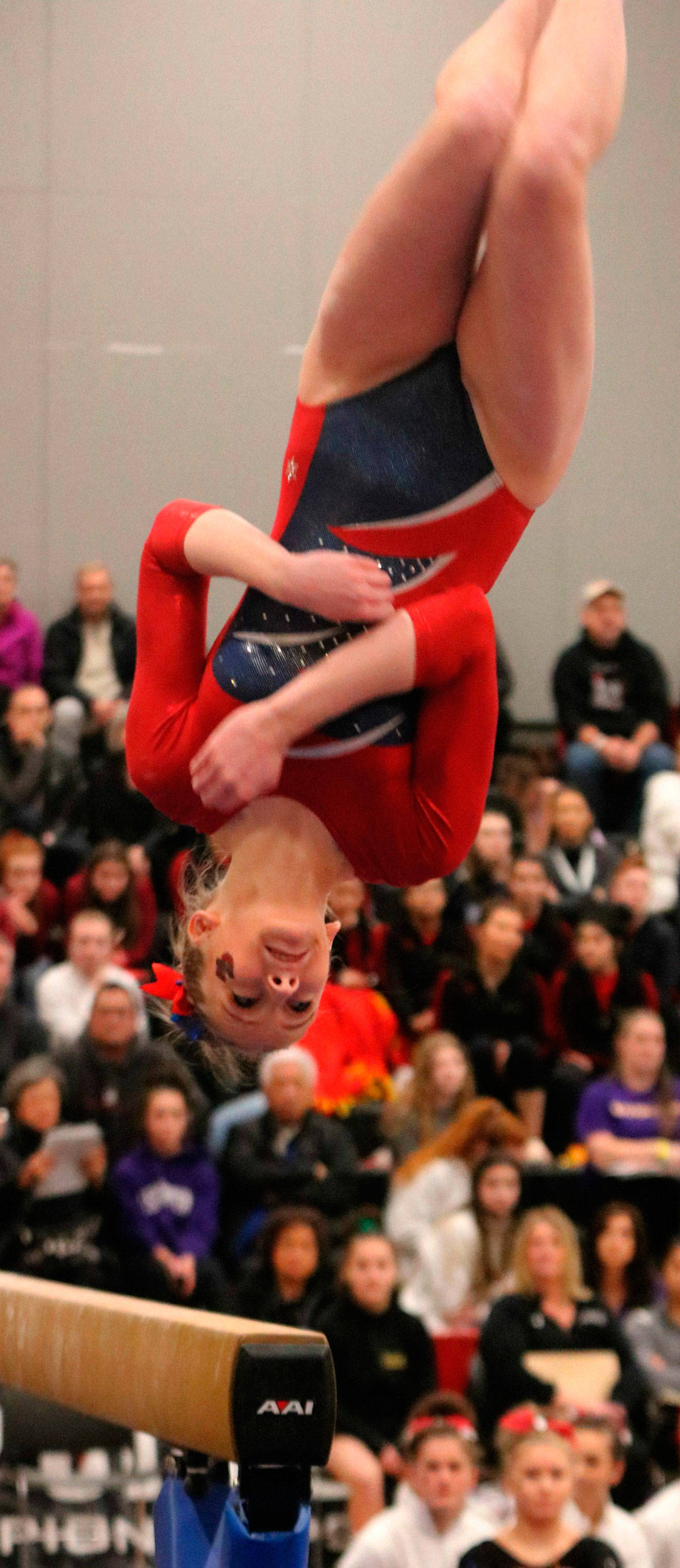 Juanita’s Allison Lofquist gets her flips on beam at state last season. Andy Nystrom / staff photo