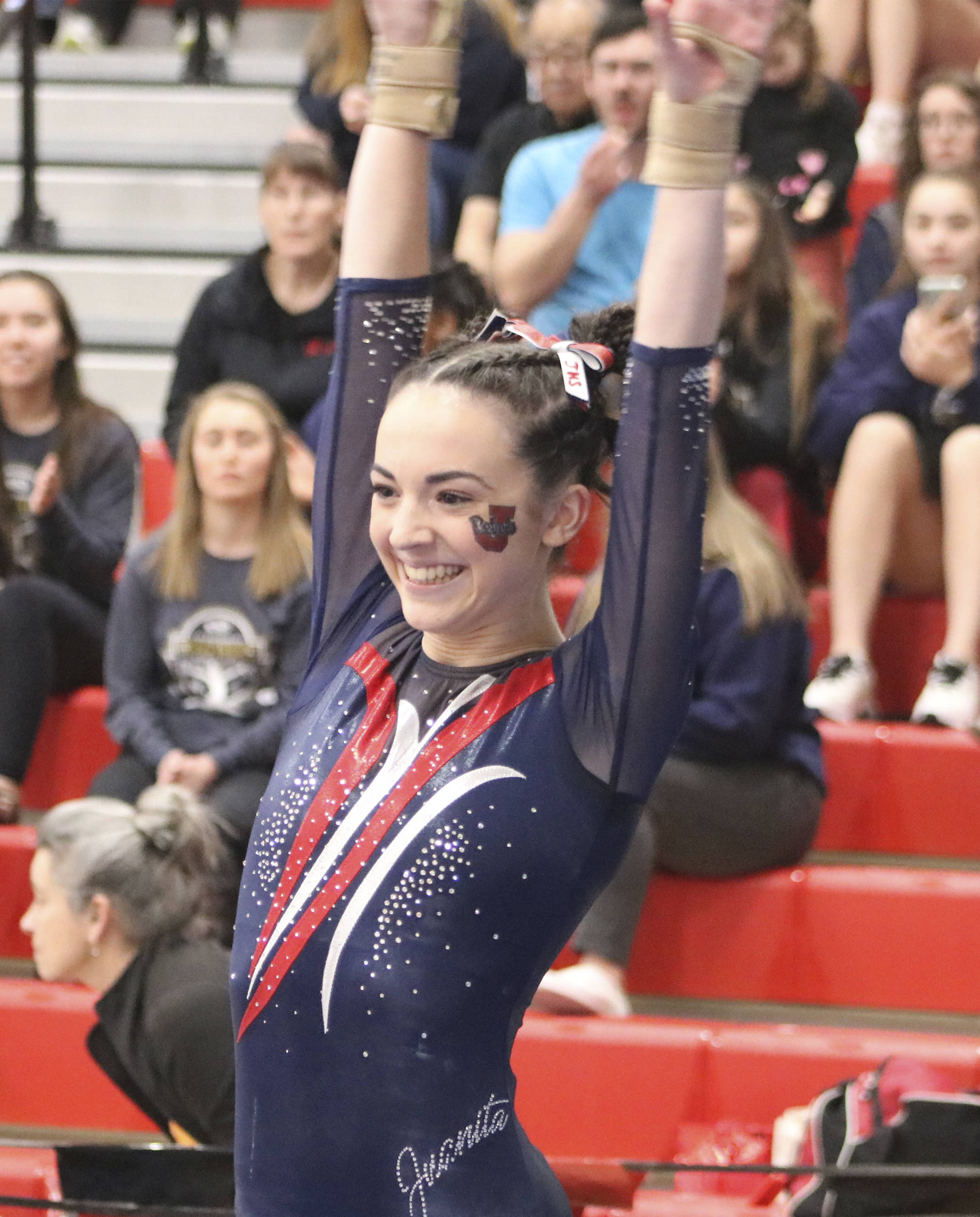 Juanita gymnast Emma Harrington salutes after performing her vault during the event finals 1A/2A/3A state gymnastics meet on Feb. 21 at Sammamish High School. Harrington finished fourth on vault with a 9.650. Benjamin Olson/staff photo