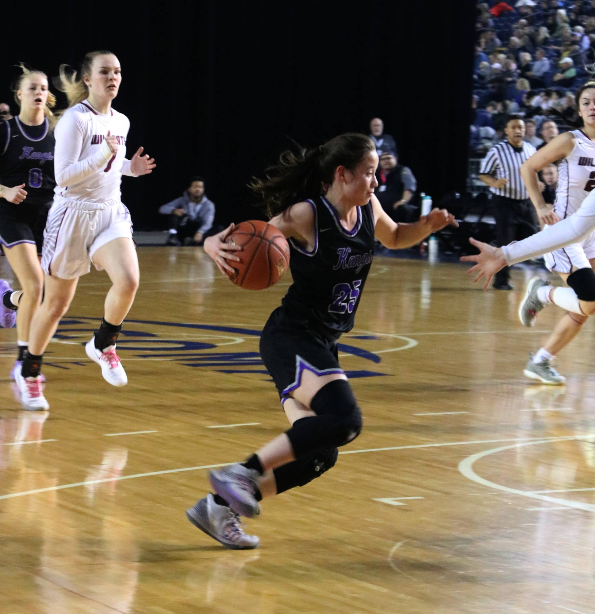 Kang Rosa Smith drives to the hoop against Mt. Spokane. Andy Nystrom/ staff photo