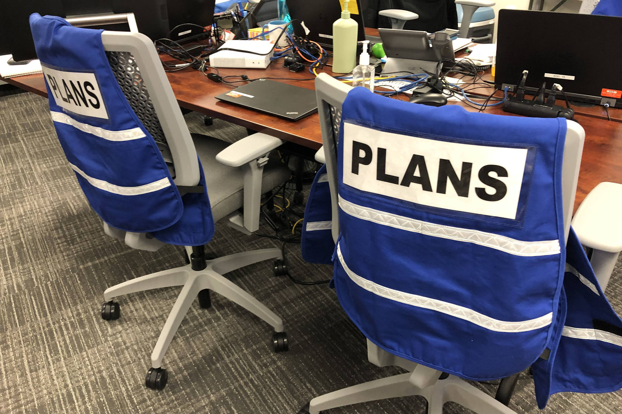 The Emergency Operation Center’s planning team’s blue vests hang on the back of chair in Kirkland City Hall on March 13. Mitchell Atencio/ Staff Photo