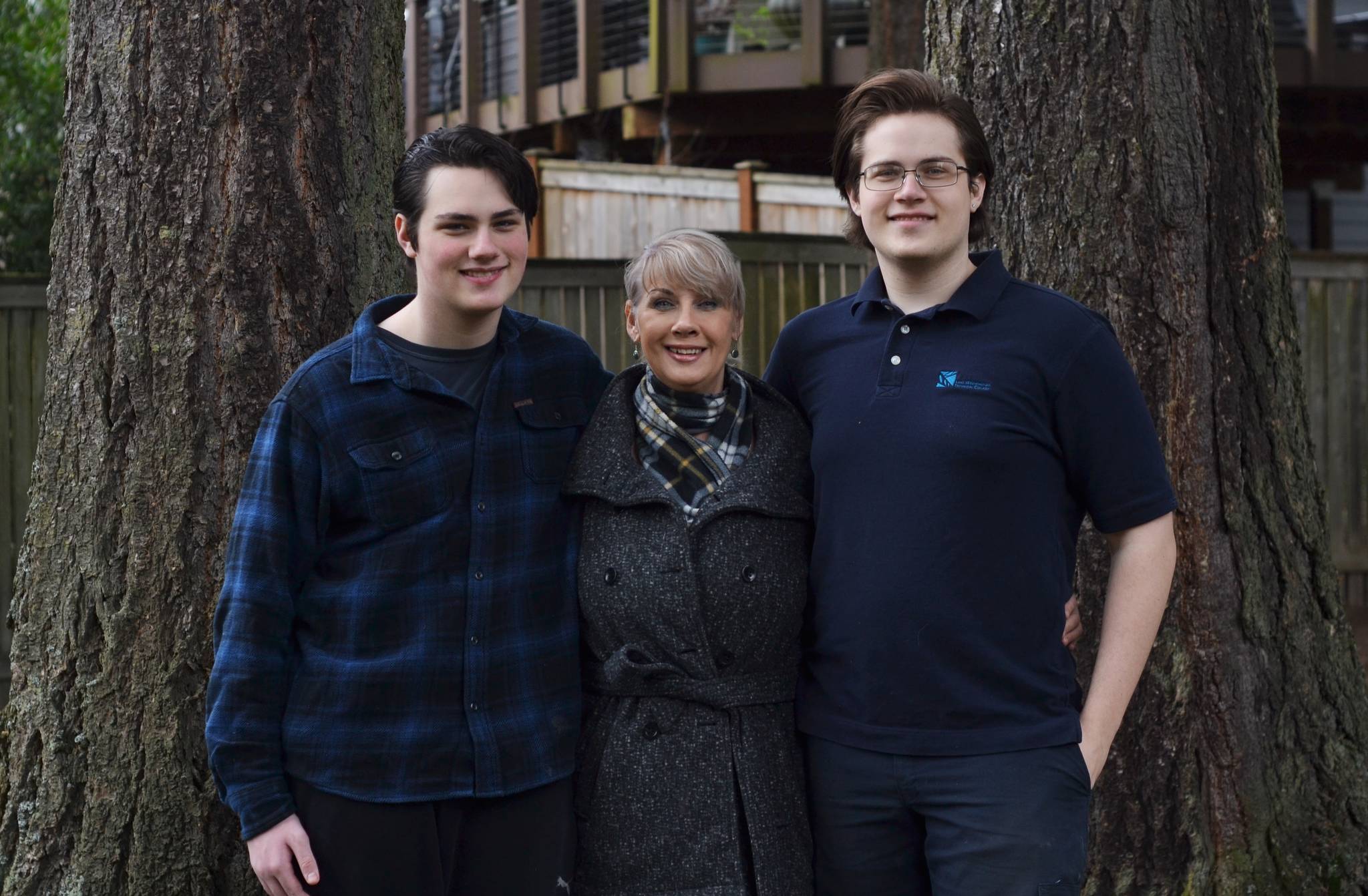 From left, Evan Shouse, Lauren Shouse and Ellienn Tatar stand outside their Kirkland residence. Courtesy photo