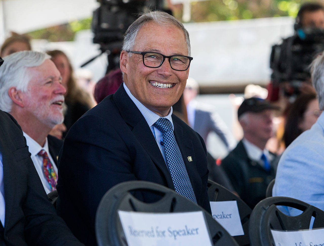 Governor Jay Inslee smiles and laughs Sept. 3, 2019, during a speech at the Lynnwood Link Extension groundbreaking in Lynnwood. A Thurston County judge ruled he exceeded his authority when he vetoed single sentences in the state transportation budget in 2019. (Olivia Vanni / Herald file)