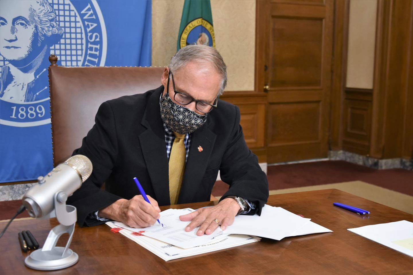 Gov. Jay Inslee, pictured in December as he signed the certified statewide election results. Courtesy photo