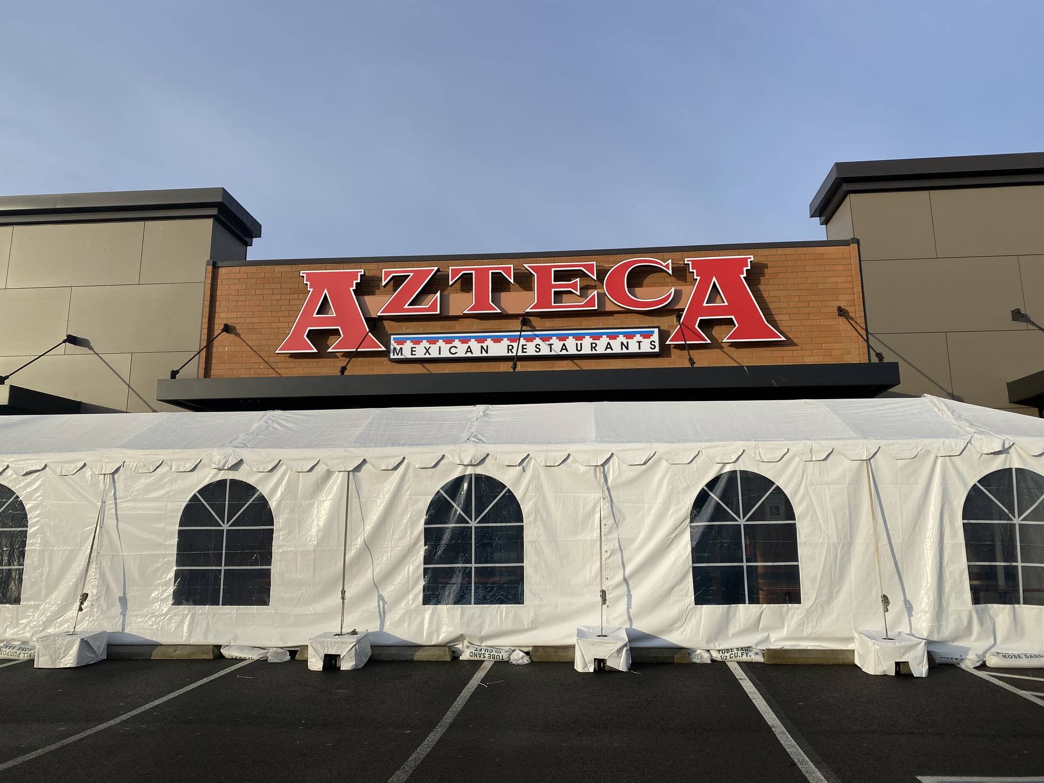 Restaurants in the region have been erecting outdoor seating in tents during the pandemic, as seen here at Azteca Mexican Restaurant in Federal Way. In Phase 2, restaurants can reopen at a maximum 25% capacity and a limit of six people per table. File photo