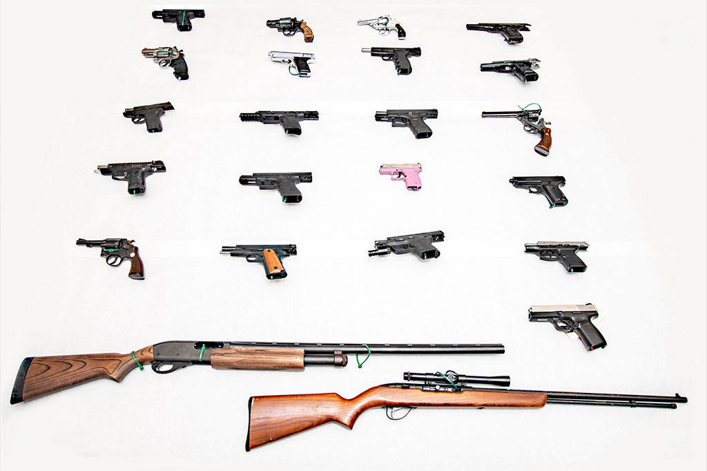 Guns seized during April 7 arrests (photo credit: Dept. of Justice)