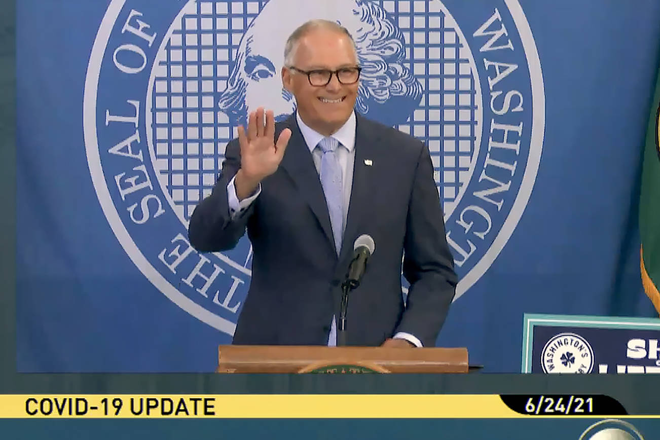 Gov. Jay Inslee waves during his Thursday morning press conference on extending protections for renters. (TVW)