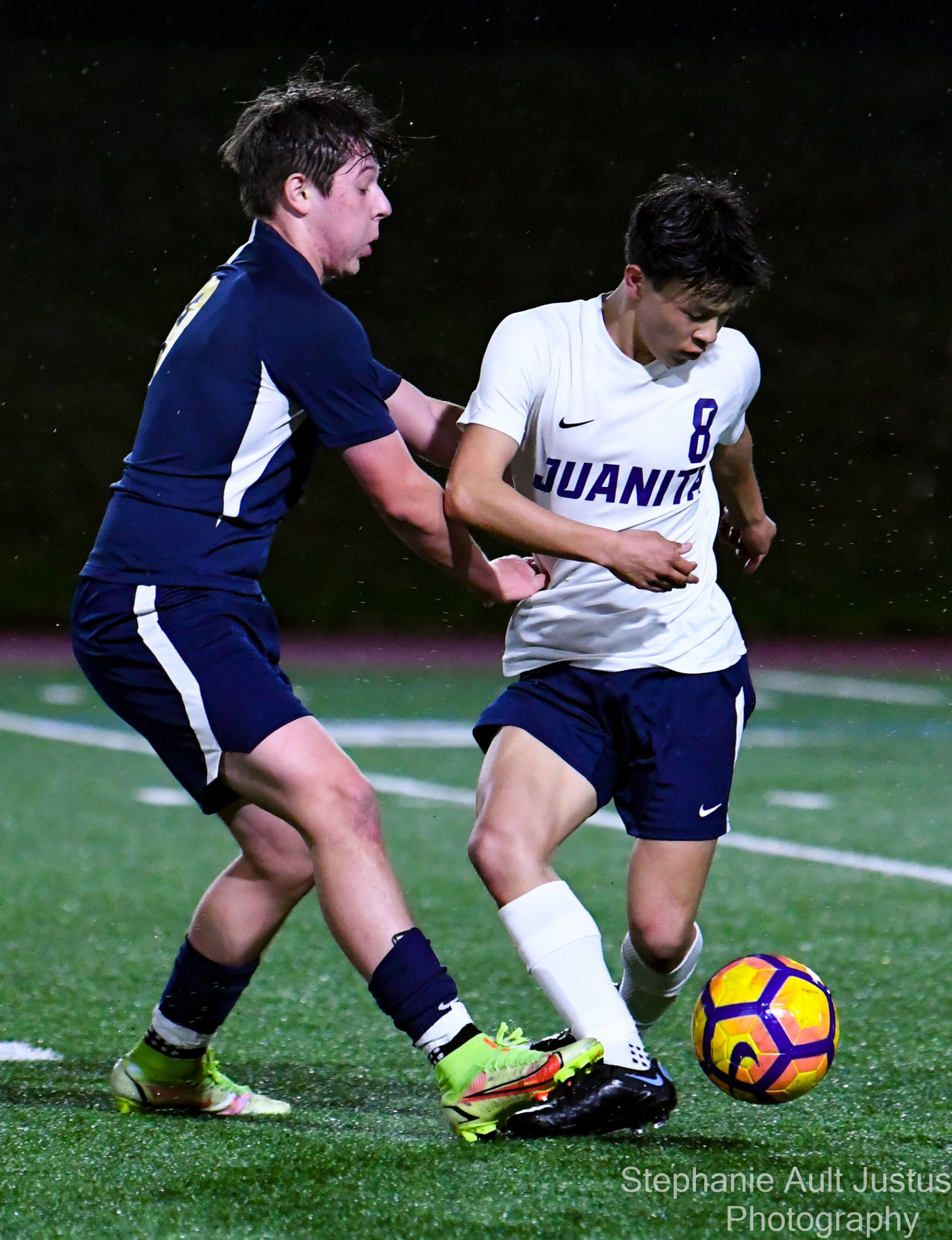 Ryan Chan (#8) keeps the ball away from Alex Mendoza (#9). Courtesy of Stephanie Ault Justus.