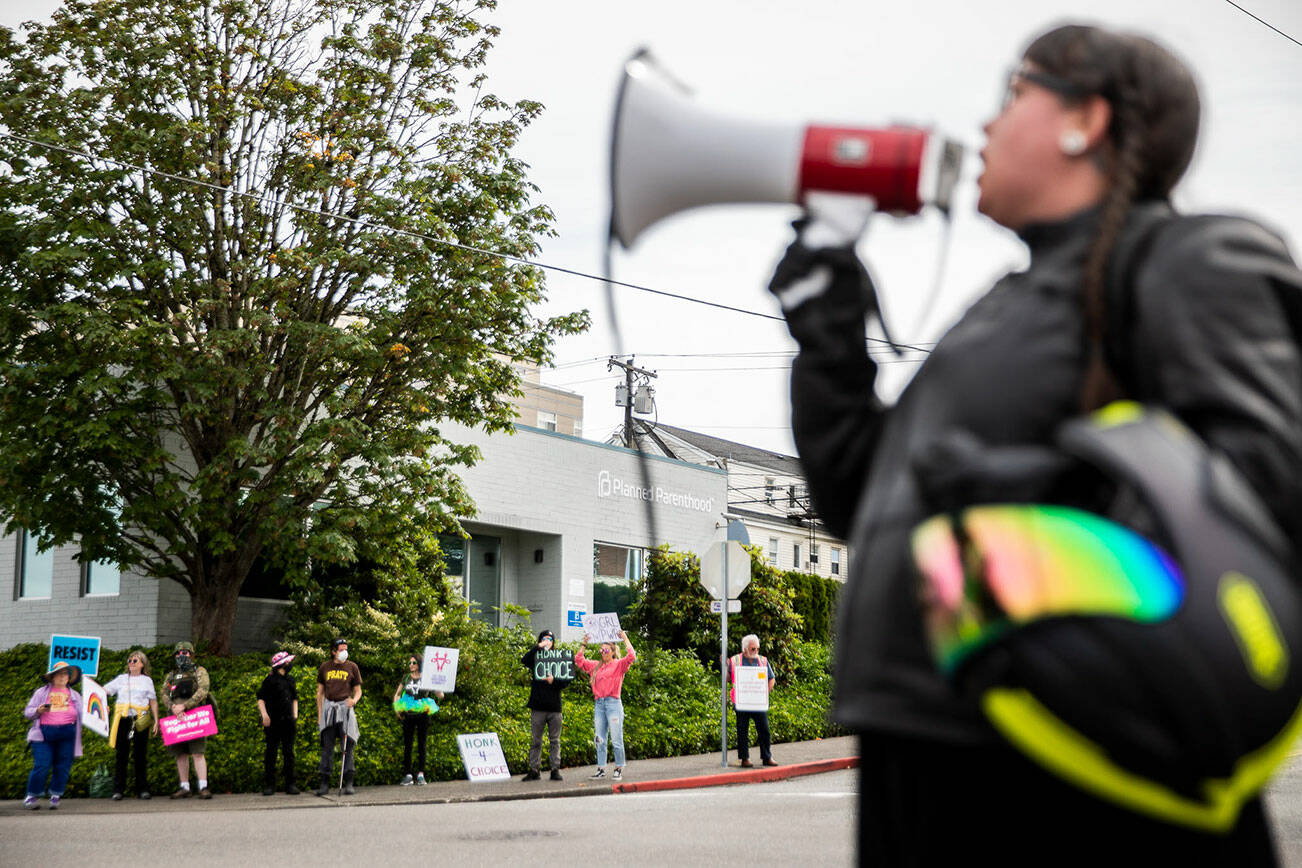 Abortion rights protesters fill all four corners of the intersection in front of the Everett Planned Parenthood in support of abortion rights on Saturday, July 9, 2022 (Olivia Vanni / Sound Publishing)