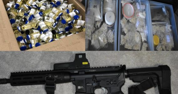 Intercepted box of illegal anabolic steroids, containers of illegal anabolic steroid pills and powder, and a firearm seized during warrant application. (Courtesy of City of Kirkland)