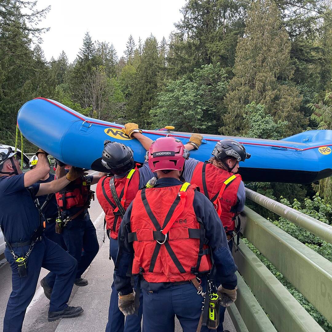 Responders lowered a raft from a 200-foot bridge over the Green River Gorge to help rescue the missing kayakers. Photo courtesy of Puget Sound Fire.